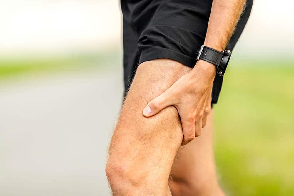 Runner Holding His Thigh In Pain