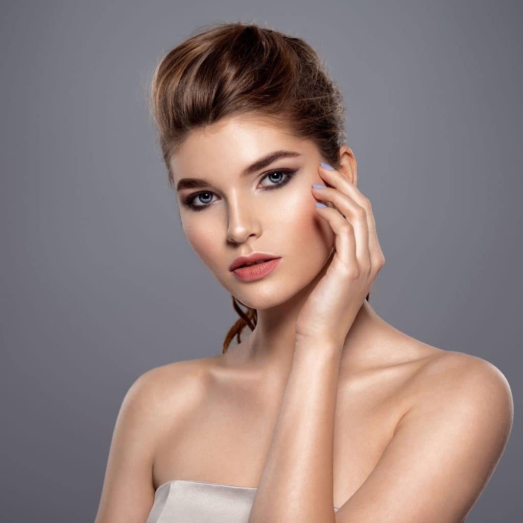 Woman Posing For A Photo With Makeup On